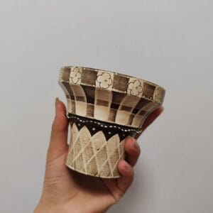 Handcrafted ceramic handless mug with hand-painted floral and lattice design